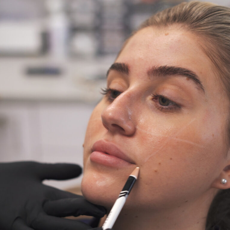 Provider administering an injectable treatment at Prime MD Aesthetics & Wellness to enhance facial balance and support natural-looking results